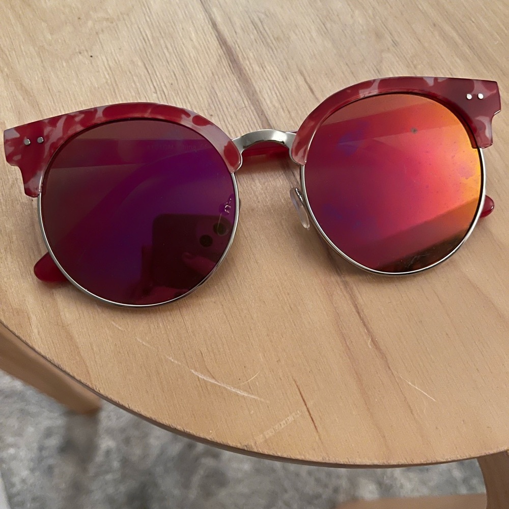 Pink, mirrored sunglasses.